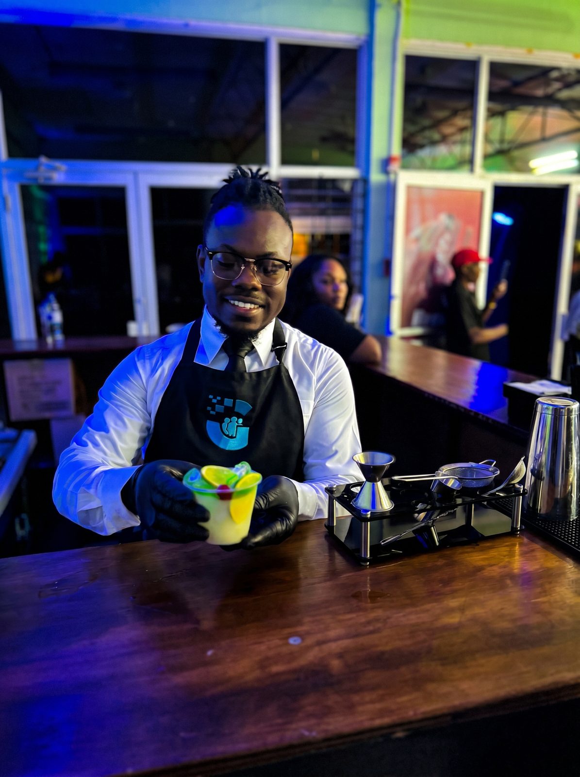 Bartender pouring signature drink